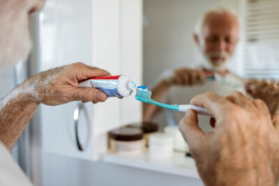 man brushing teeth