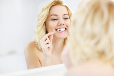 flossing woman